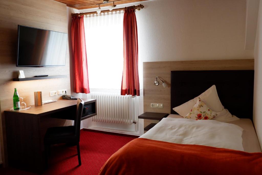 Postel nebo postele na pokoji v ubytování Hotel Schoos