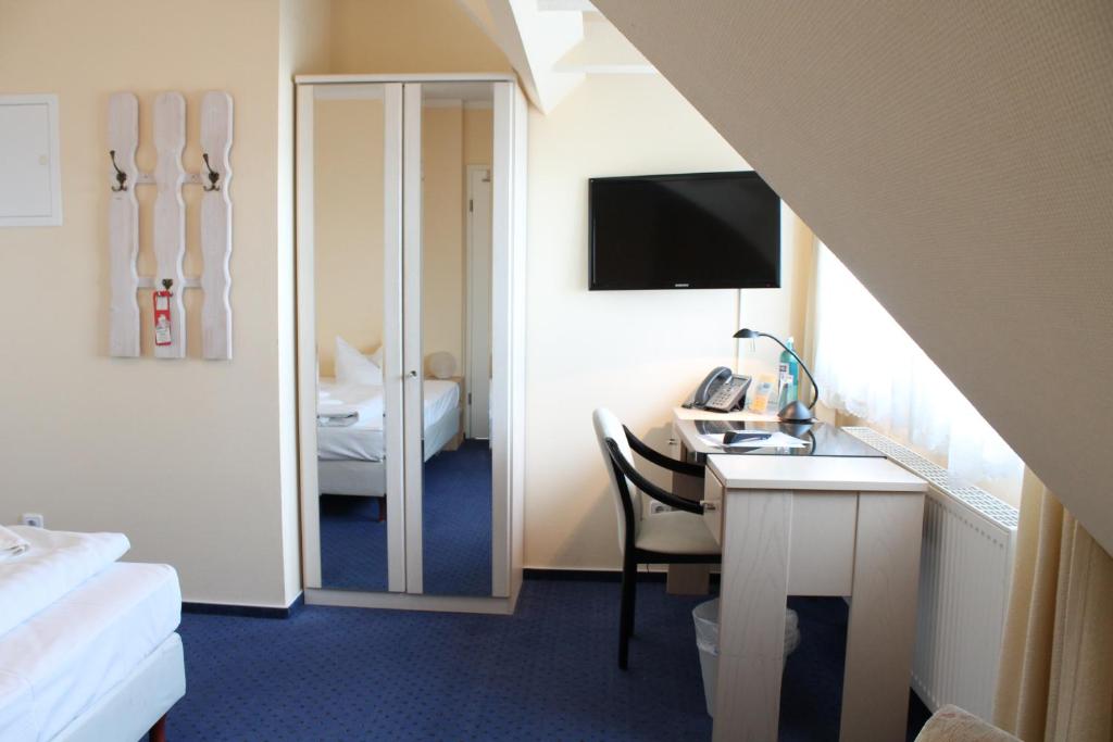 Postel nebo postele na pokoji v ubytování Hotel Stolteraa