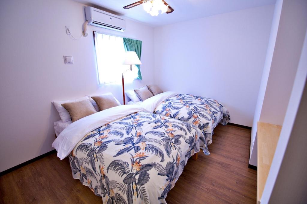 Ένα ή περισσότερα κρεβάτια σε δωμάτιο στο Kurarisu2 RoomD