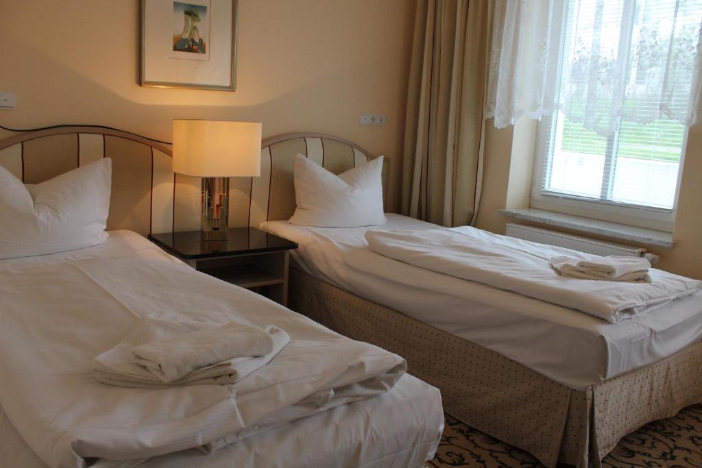 Postel nebo postele na pokoji v ubytování Hotel Stolteraa
