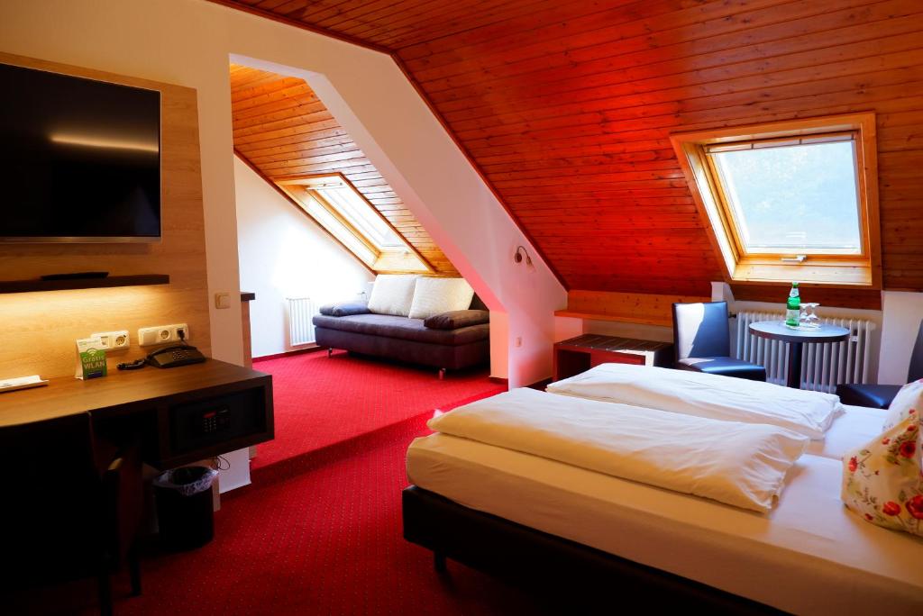 Postel nebo postele na pokoji v ubytování Hotel Schoos