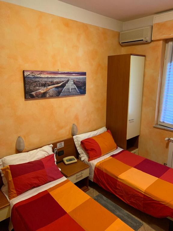 Postel nebo postele na pokoji v ubytování Albergo Ristorante Brera