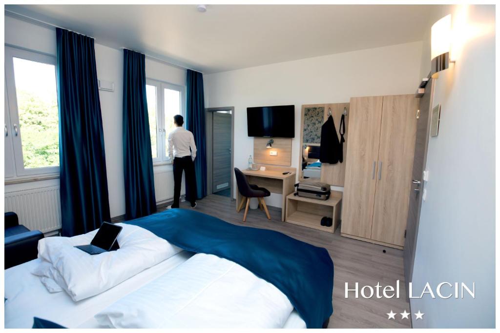 Postel nebo postele na pokoji v ubytování Hotel LACIN