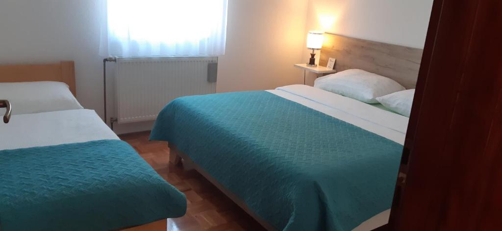 Posteľ alebo postele v izbe v ubytovaní Apartment Golden Fields