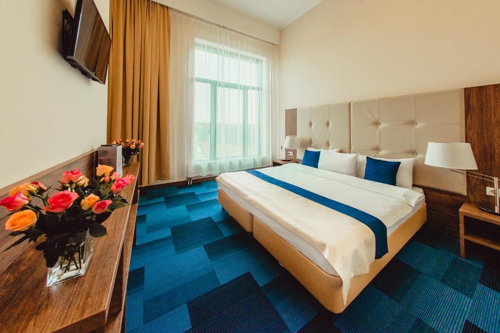 Ліжко або ліжка в номері SkyPoint Hotel Sheremetyevo Airport