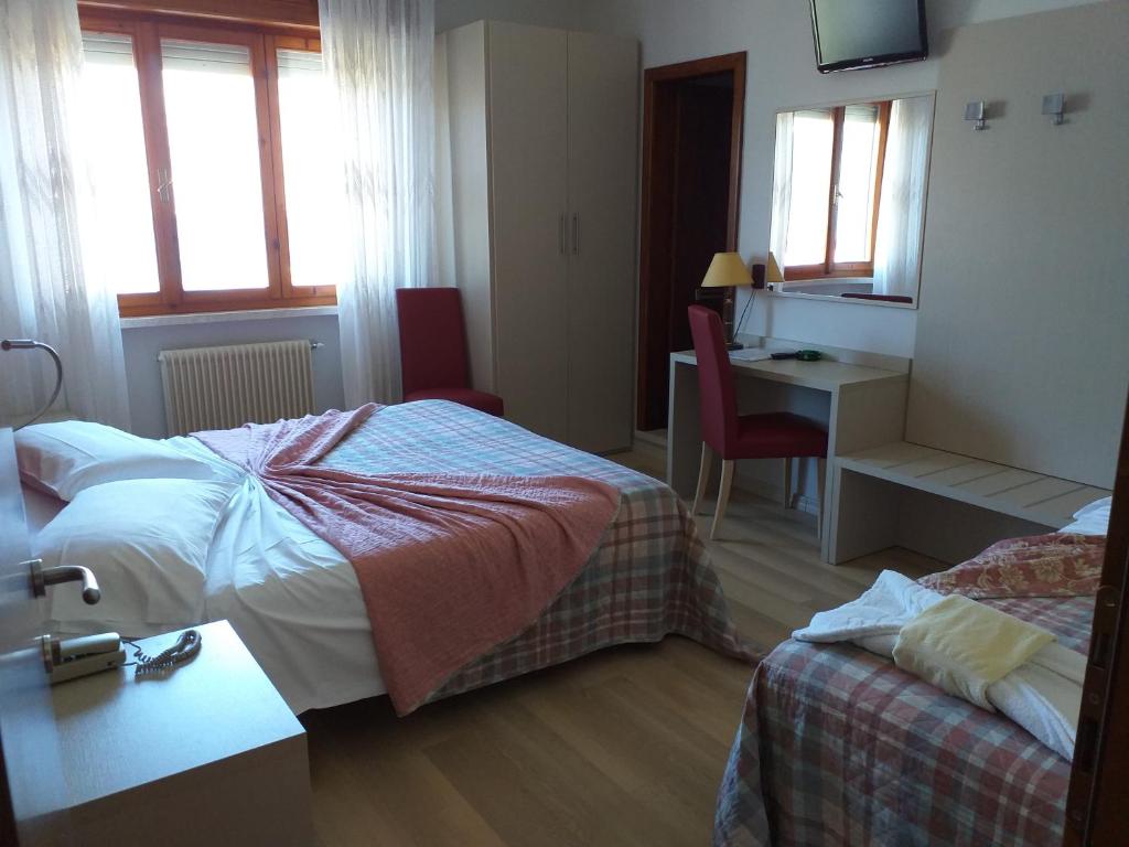 Postel nebo postele na pokoji v ubytování Garnì Casa Rabagno