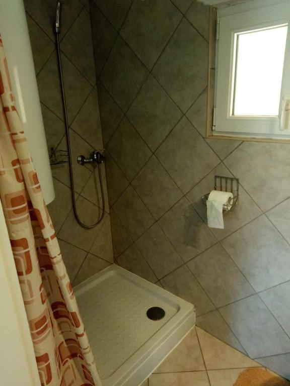 Kúpeľňa v ubytovaní Karos Centrál Apartmanház