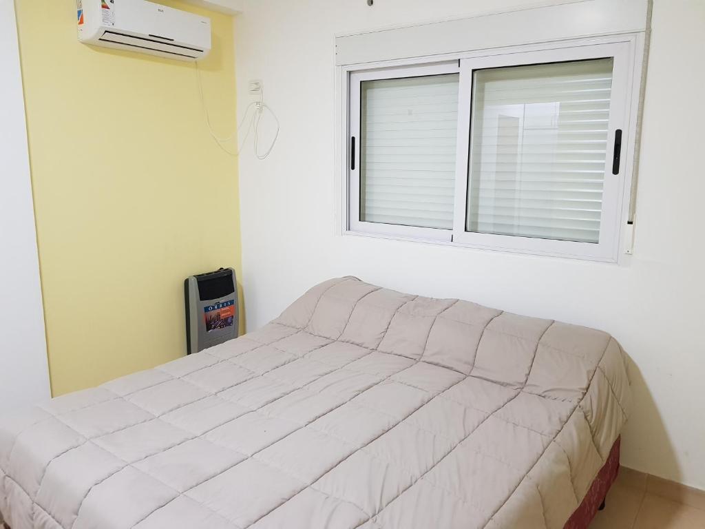 Posteľ alebo postele v izbe v ubytovaní Departamenos Llanos