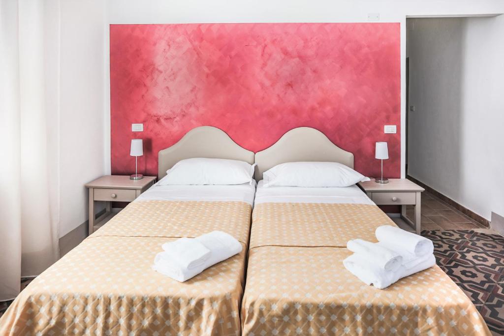 Postel nebo postele na pokoji v ubytování Tenuta Villa Colle Sereno