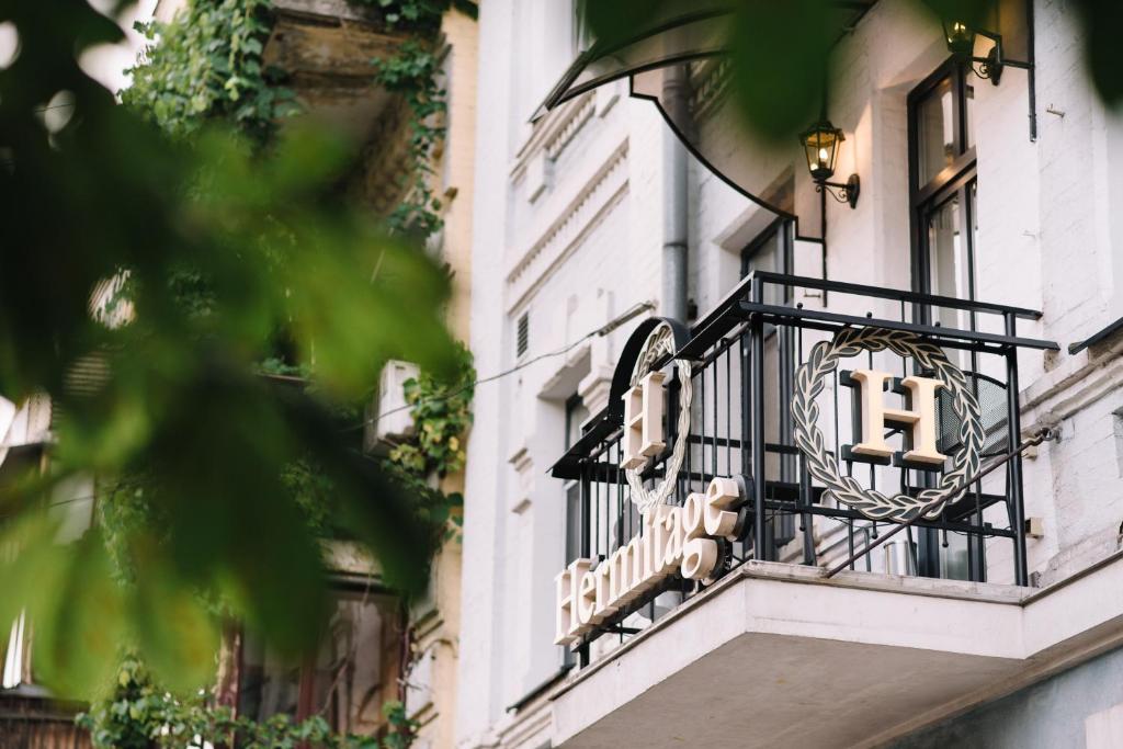 a sign on the side of a building at Hermitage Boutique-Hotel in Kyiv