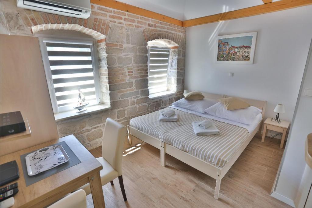 Postel nebo postele na pokoji v ubytování Split Inn Apartments