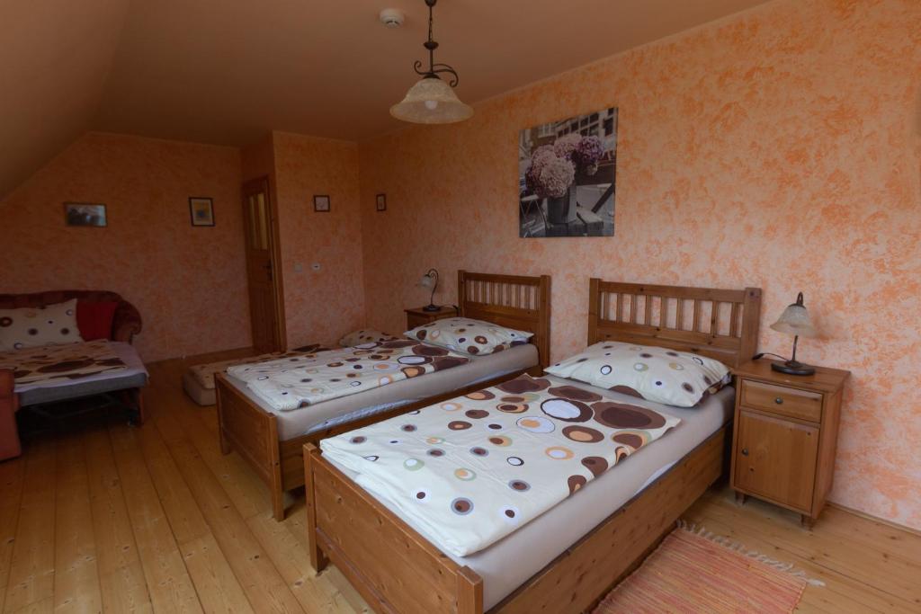 Postel nebo postele na pokoji v ubytování Penzion Pod Hradem