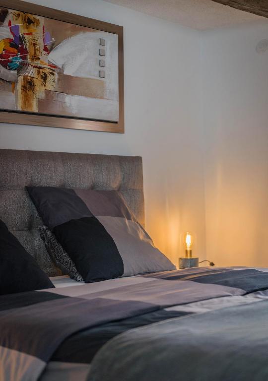 Postel nebo postele na pokoji v ubytování Le Carré d'or - Appartement avec vue Cathédrale