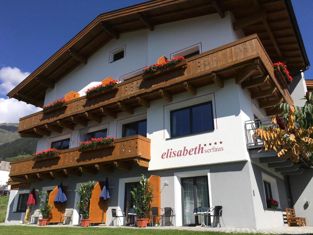 a building with flowers on the side of it at Elisabeth Serfaus inkl der SUPER SOMMER CARD im SOMMER 2024 in Serfaus