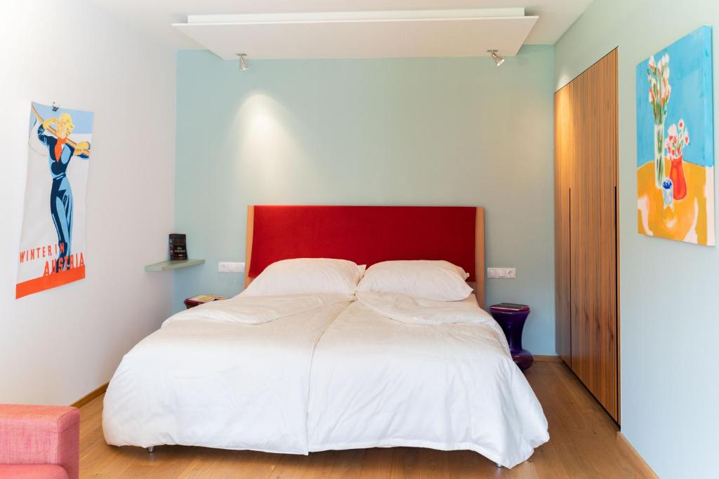 Postel nebo postele na pokoji v ubytování Alpinikum Apartments