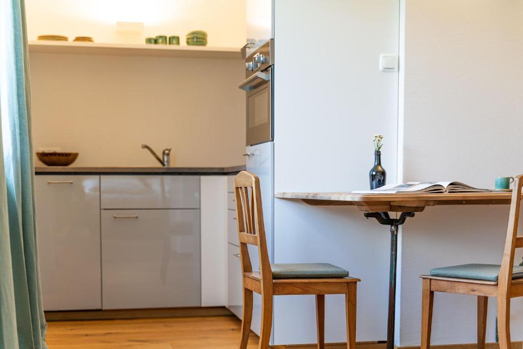 Kuchyň nebo kuchyňský kout v ubytování Alpinikum Apartments