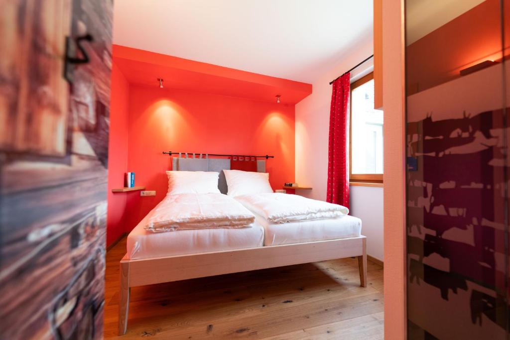 Postel nebo postele na pokoji v ubytování Alpinikum Apartments