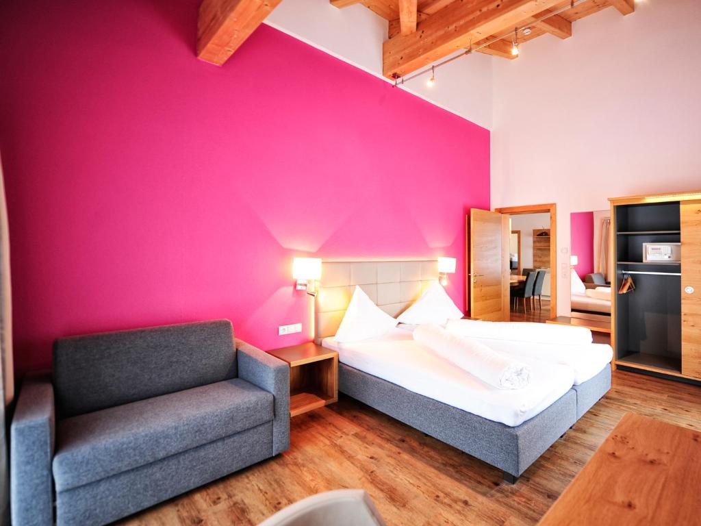 Postel nebo postele na pokoji v ubytování Hotel Garni Alpenland