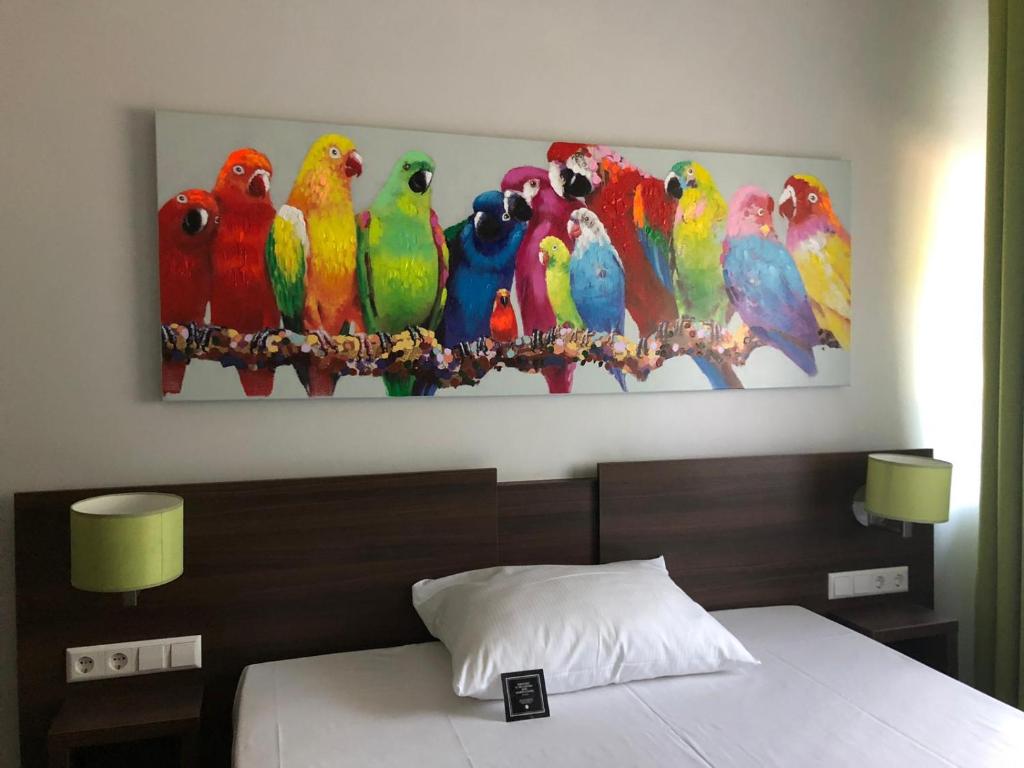 Postel nebo postele na pokoji v ubytování Arthotel ANA Eden
