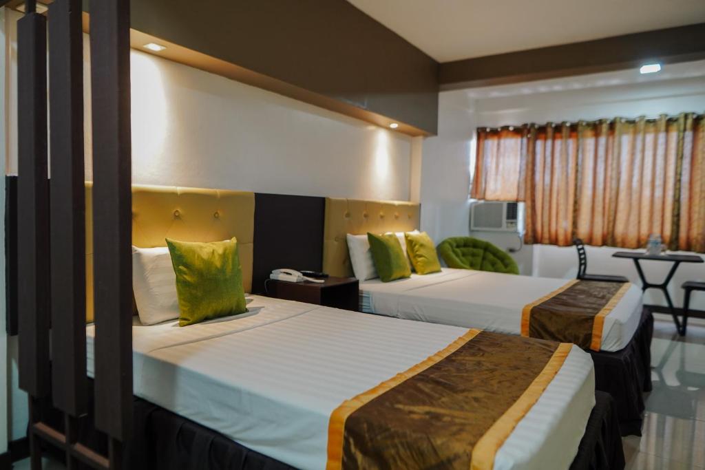 מיטה או מיטות בחדר ב-North Tourist Inn
