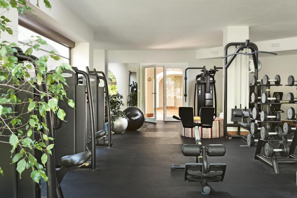 a gym with treadmills and elliptical machines at Hotel Abi d'Oru in Porto Rotondo