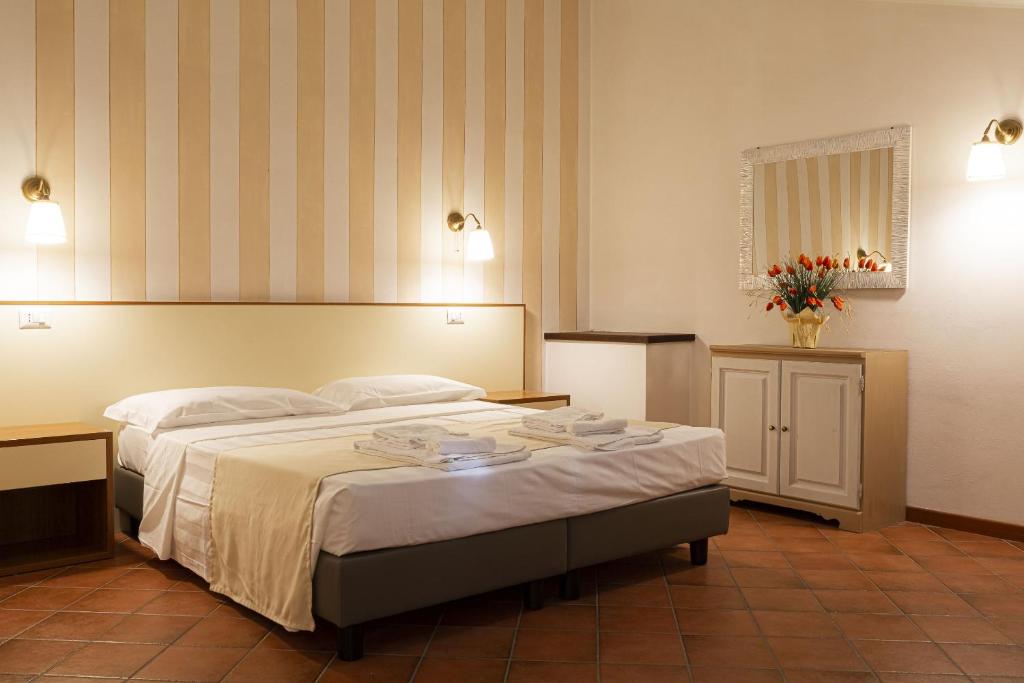 Postel nebo postele na pokoji v ubytování Toscana Verde