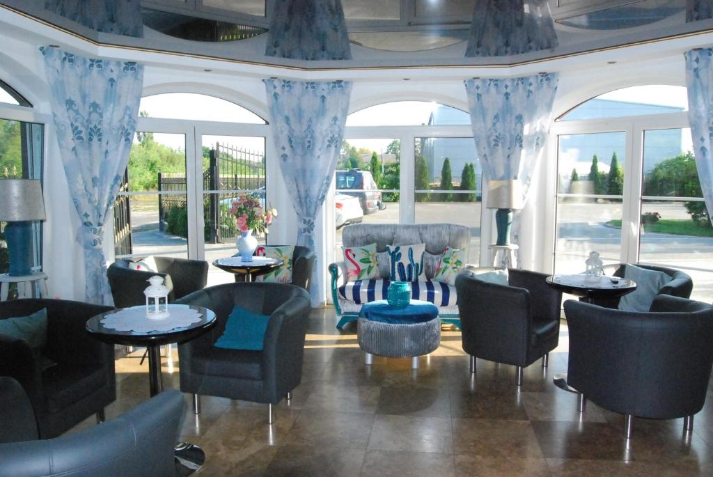 Posezení v ubytování Amigo Hotel