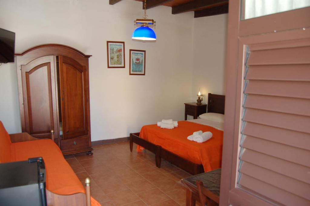 Postel nebo postele na pokoji v ubytování Hotel Al Togo Fitness & Relax