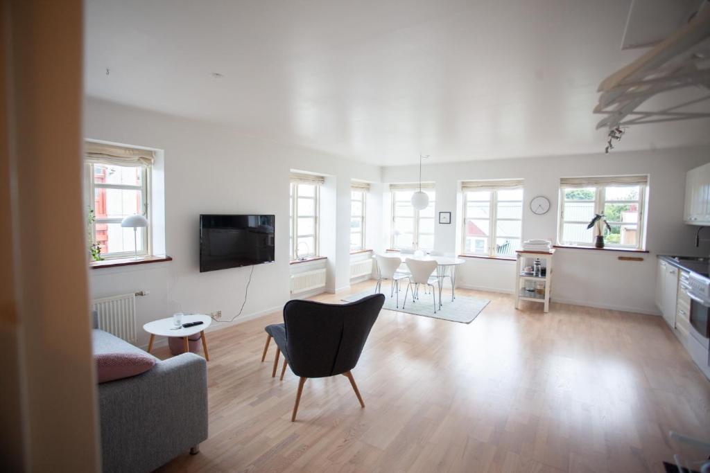 a living room with a couch and a table at Central apartment in Tórshavn in Tórshavn