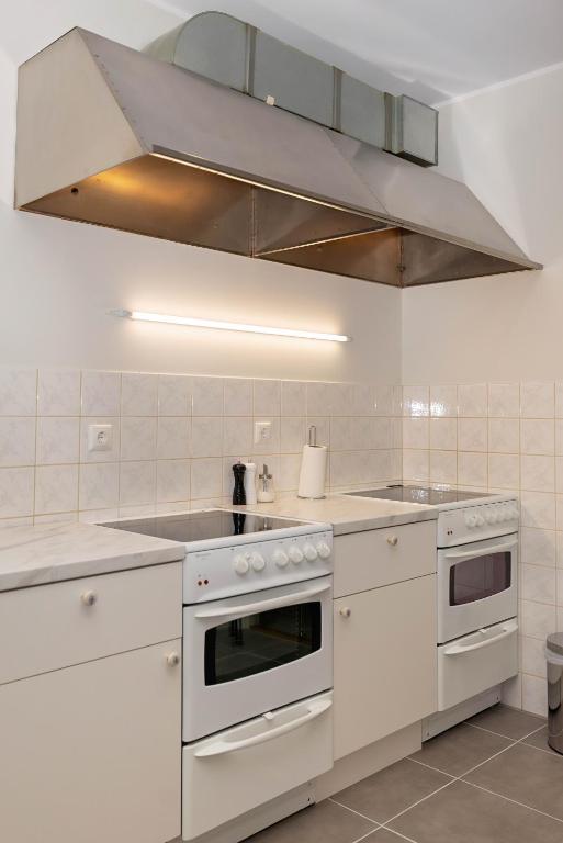 Kuchyň nebo kuchyňský kout v ubytování Mia Guesthouse
