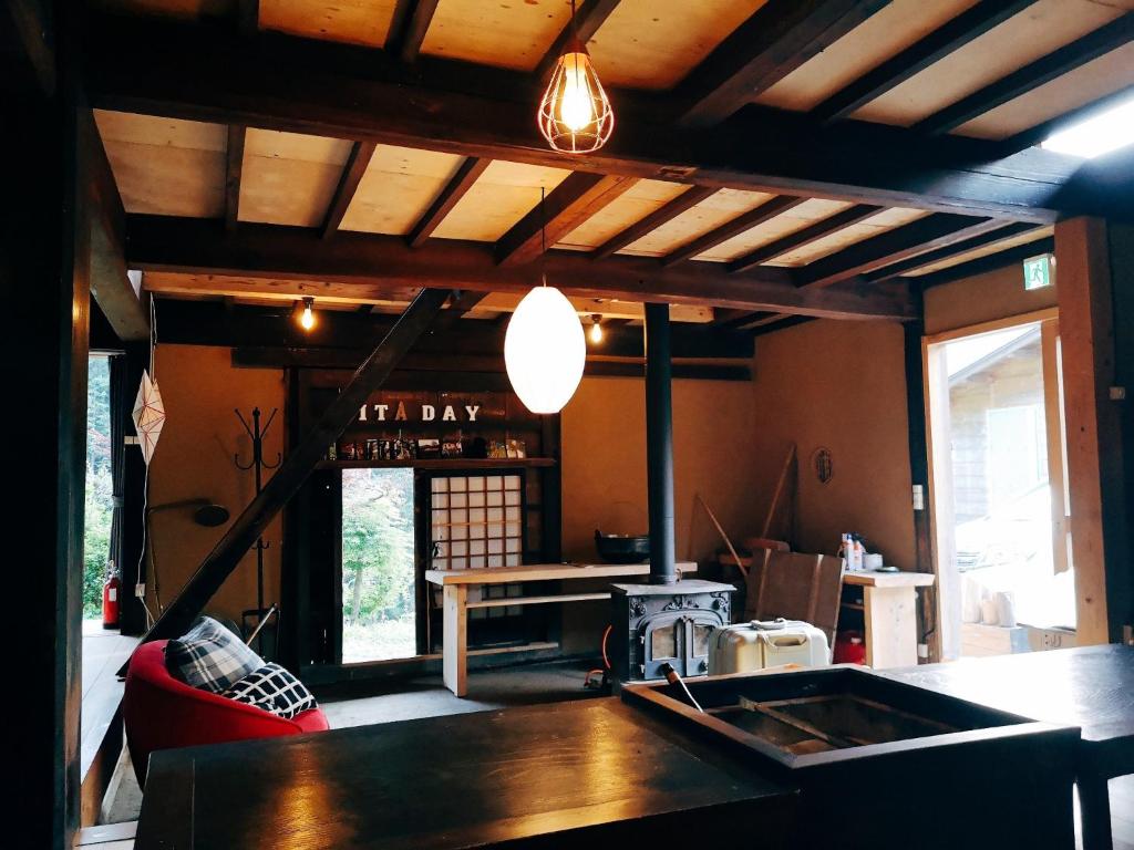 a living room with a kitchen with a table at Uenohara - House / Vacation STAY 47885 in Uenohara