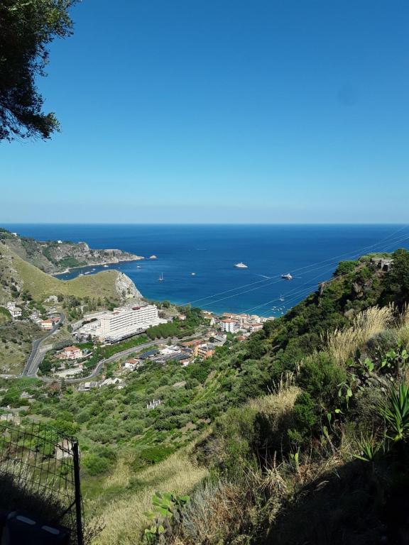 a view of the ocean from a hill at A Casa da Paola in Taormina