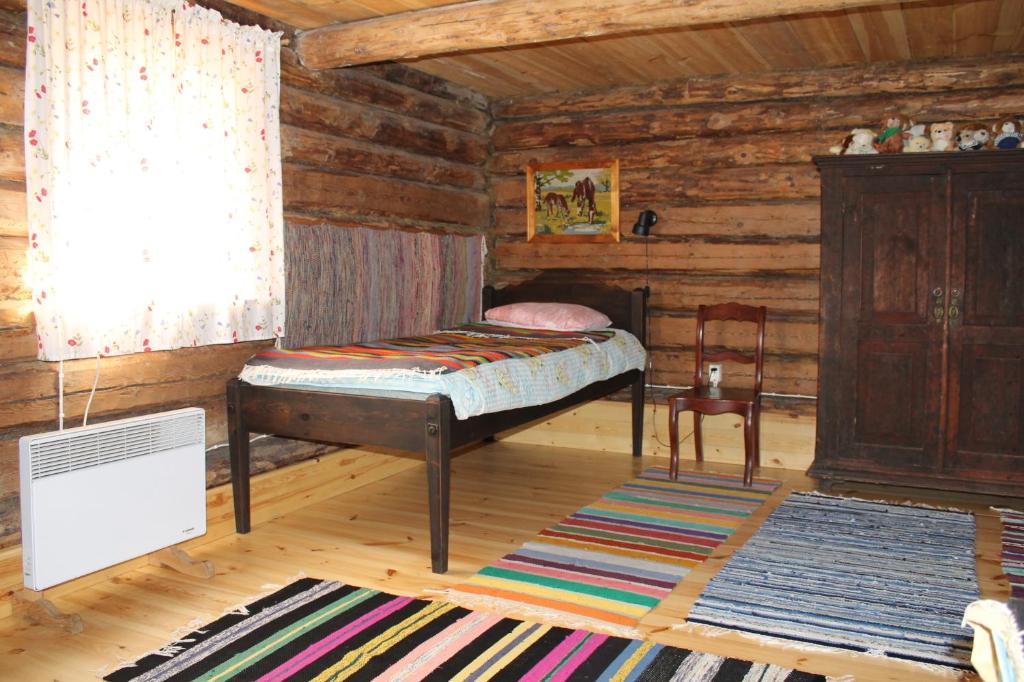 Postel nebo postele na pokoji v ubytování Männi Summerhouse