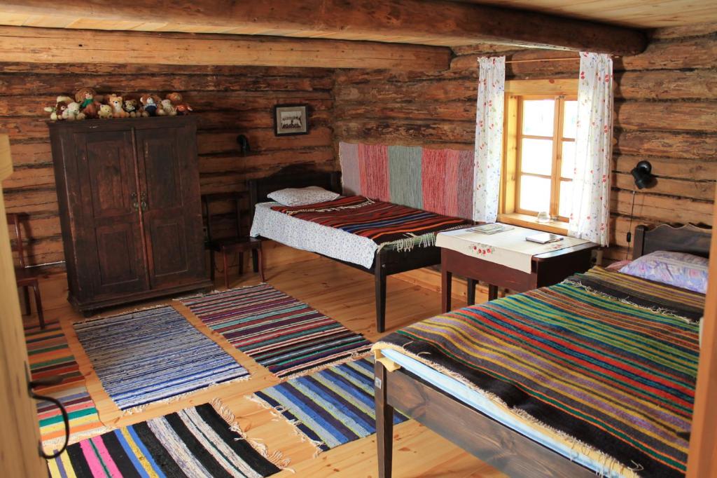 Postel nebo postele na pokoji v ubytování Männi Summerhouse