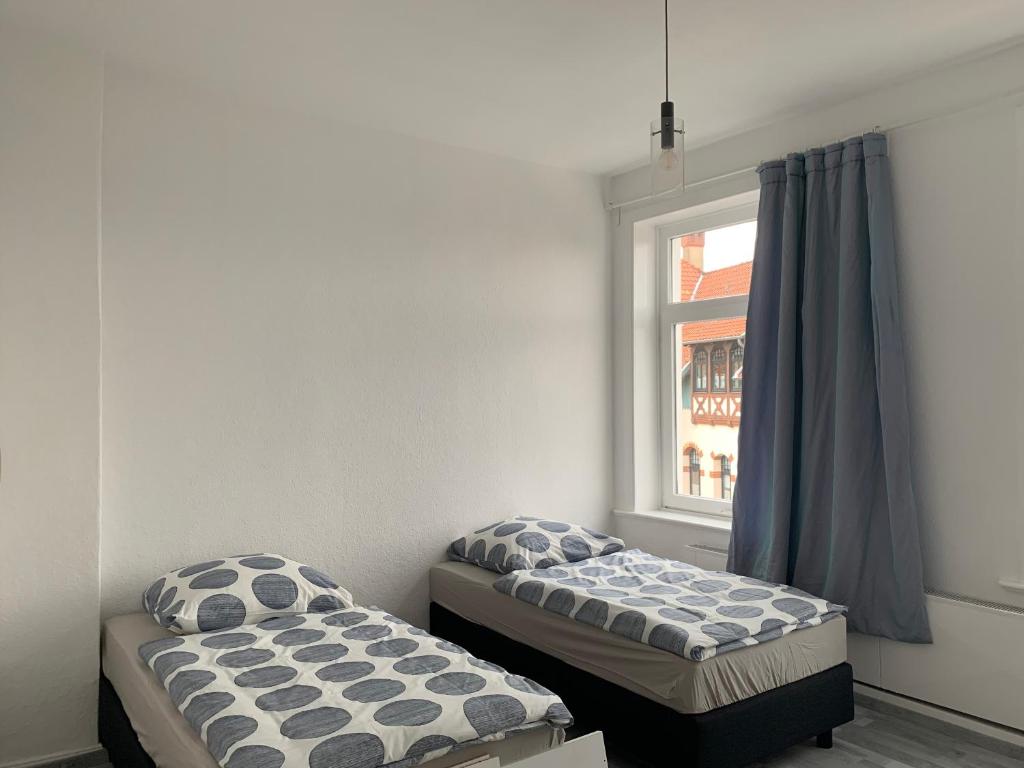 מיטה או מיטות בחדר ב-Modern House Gehrden 2