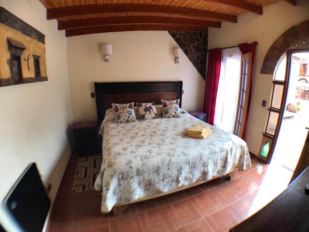 Postel nebo postele na pokoji v ubytování Hostal Puritama
