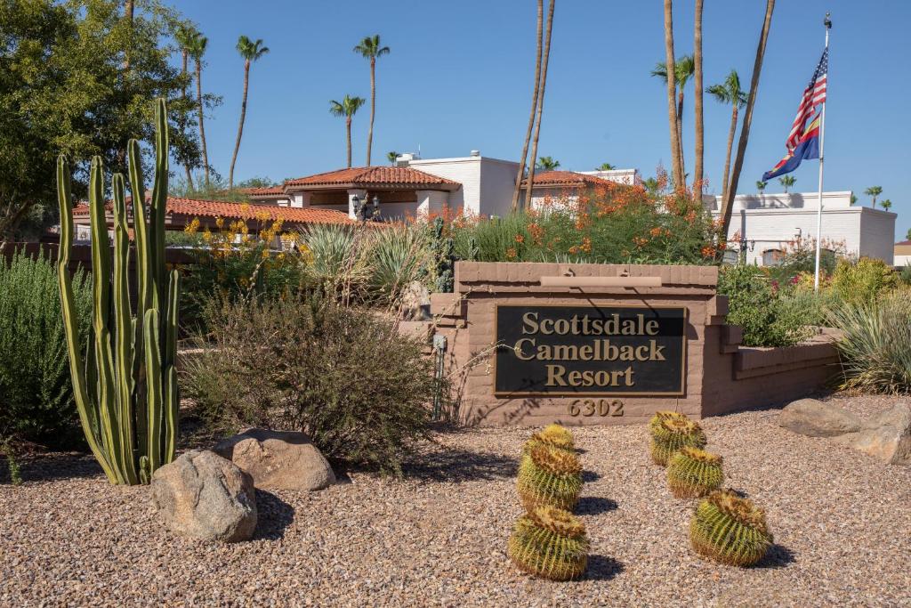 a sign for the southatlantic camelback resort with cacti at Scottsdale Camelback Resort in Scottsdale