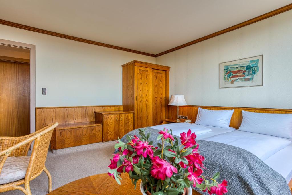 Postel nebo postele na pokoji v ubytování FF&E Hotel Dania