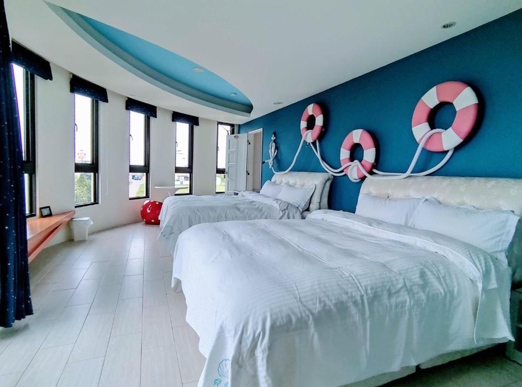 Postel nebo postele na pokoji v ubytování Shell Sand Homestay