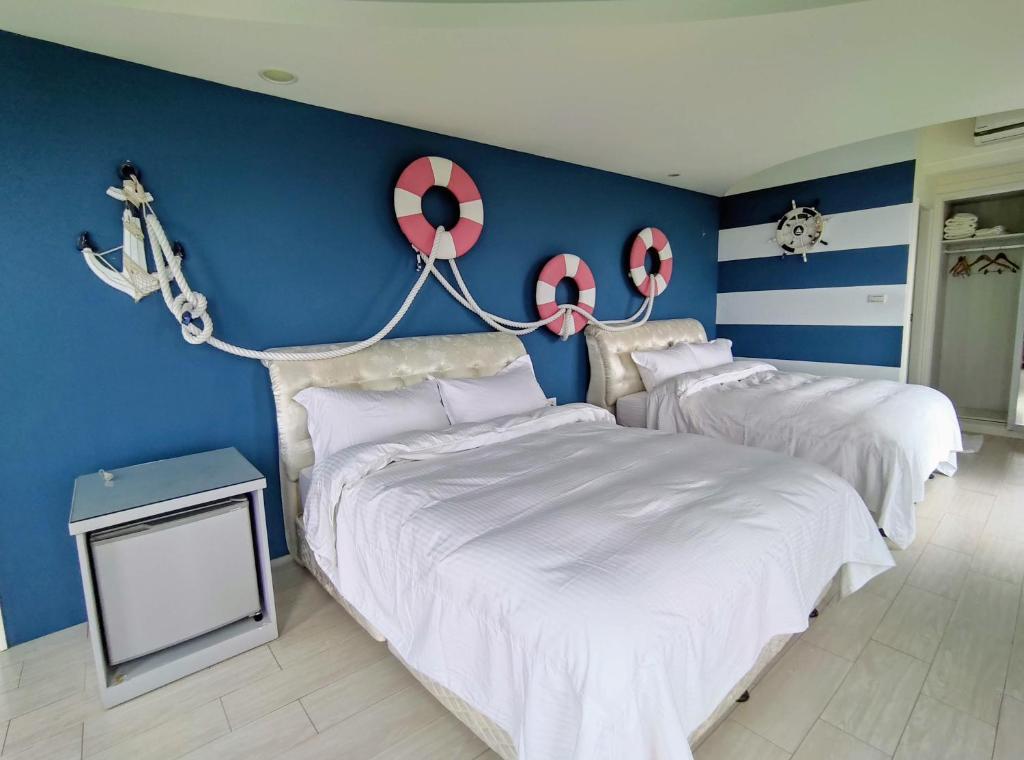 Postel nebo postele na pokoji v ubytování Shell Sand Homestay