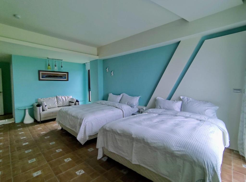 Postel nebo postele na pokoji v ubytování Shell Sand Homestay