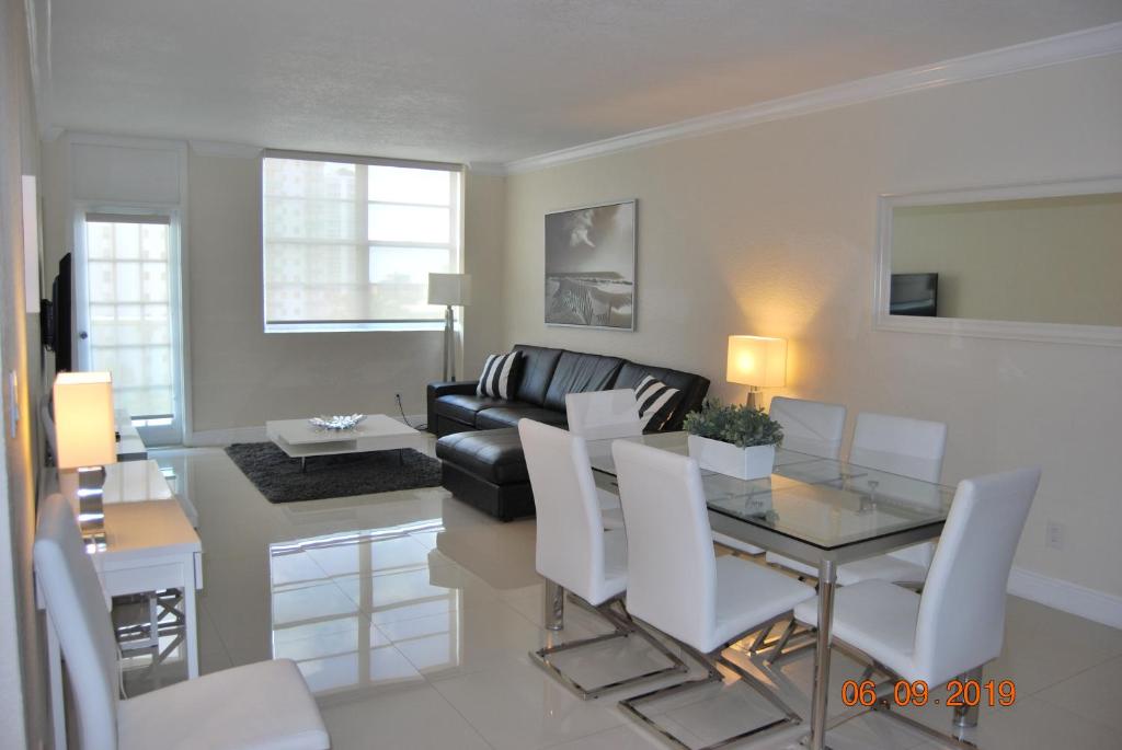 a living room with a table and a couch at Ocean Reserve Piso 7 STR-310 in Miami Beach