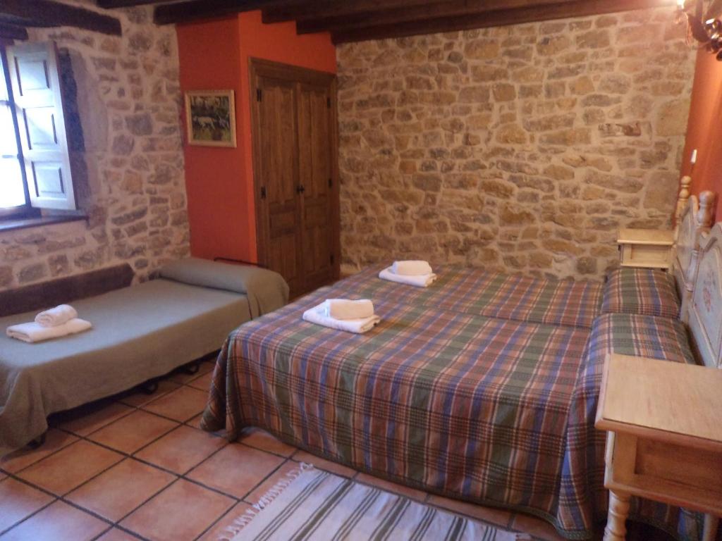 Postel nebo postele na pokoji v ubytování Casa rural La Toba I y II