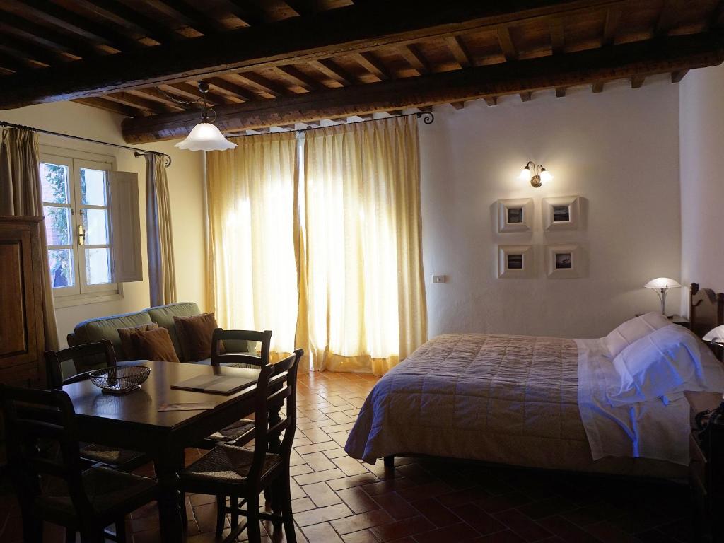 Posteľ alebo postele v izbe v ubytovaní Borgo Colleoli Resort