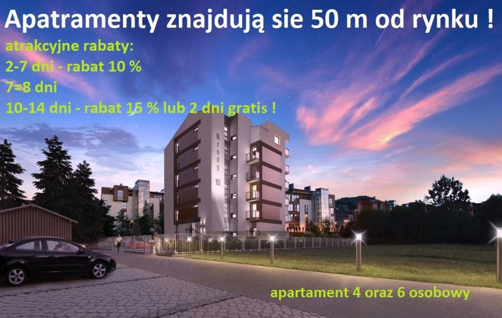 a car parked on a road in front of a building at Apartament Eliza in Ustroń