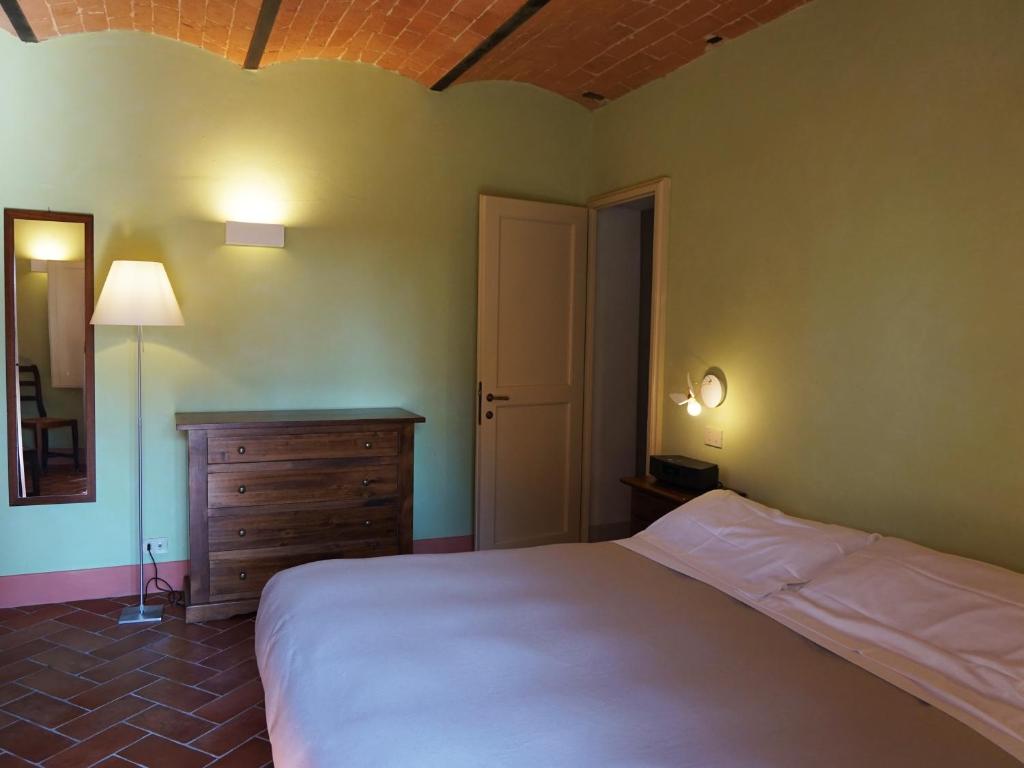 Posteľ alebo postele v izbe v ubytovaní Borgo Colleoli Resort