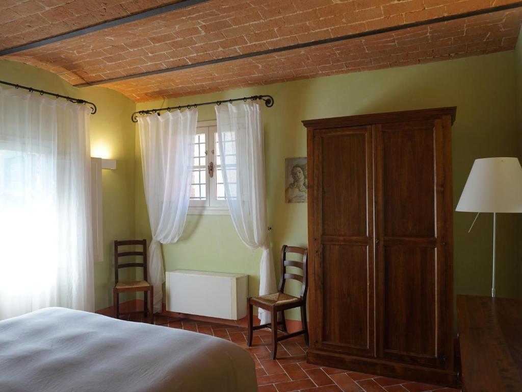Posteľ alebo postele v izbe v ubytovaní Borgo Colleoli Resort