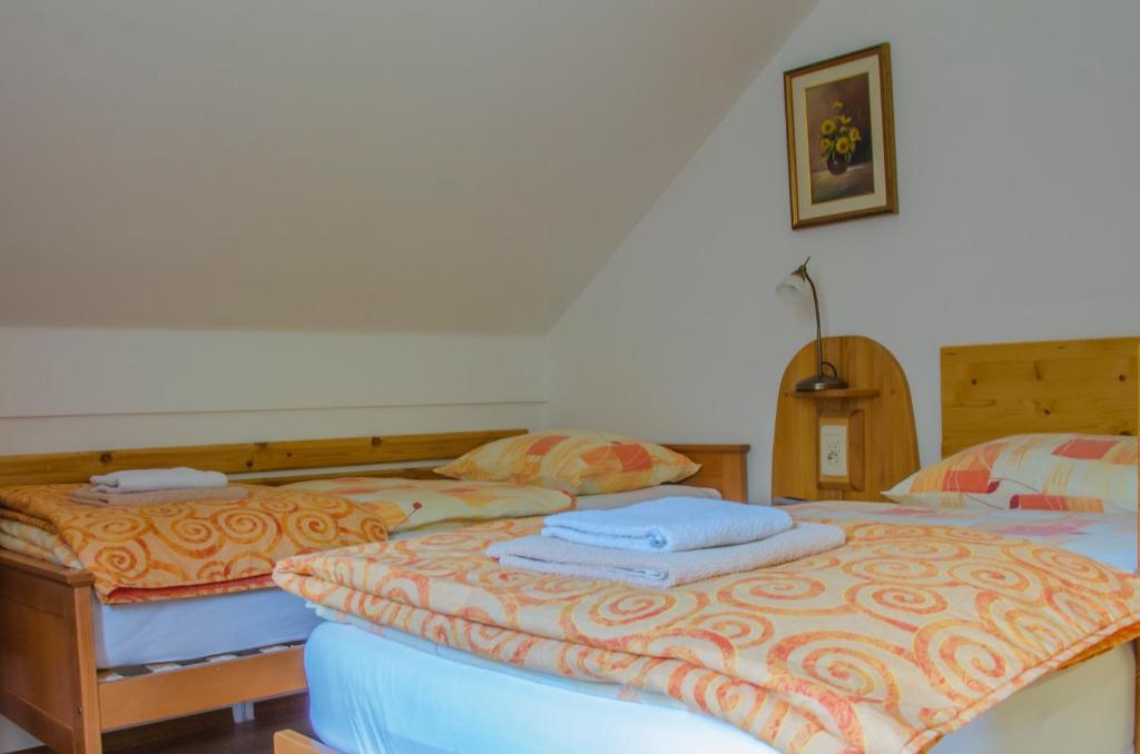 Postel nebo postele na pokoji v ubytování Miškar Rooms