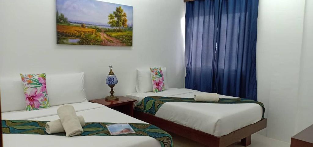 Postel nebo postele na pokoji v ubytování Discover Boracay Hotel