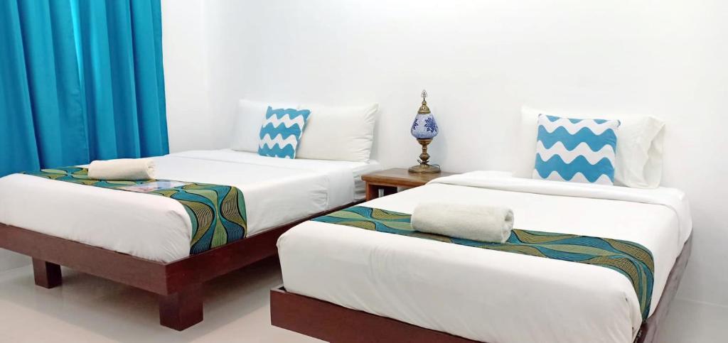 Postel nebo postele na pokoji v ubytování Discover Boracay Hotel